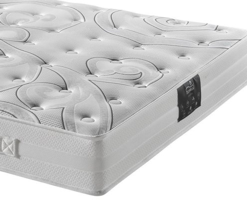 Gros plan sur un matelas blanc au motif texturé et tourbillonnant rappelant l'élégance parisienne, avec une étiquette noire sur le côté. Le savoir-faire témoigne d'une qualité inégalée et offre un confort exceptionnel sans le prix élevé. Canape Paris by Atelier Bis