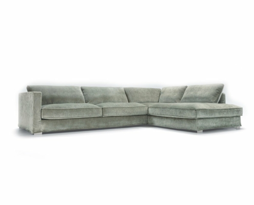 Canapé vert en L avec coussins moelleux sur fond blanc, offrant une excellente qualité. Canape Paris by Atelier Bis
