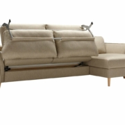 Canapé convertible beige partiellement déplié avec pieds en bois, parfait pour un showroom parisien chic. Canape Paris by Atelier Bis