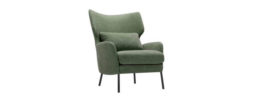 Fauteuil vert moderne avec pieds noirs et coussin assorti sur fond blanc, offrant une qualité exceptionnelle qui se démarque dans n'importe quel espace. Canape Paris by Atelier Bis
