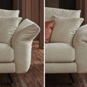 Gros plan d'un canapé beige à Paris, mettant en valeur les positions réglables des accoudoirs, complétées par un coussin d'appoint marron sur le siège. Canape Paris by Atelier Bis