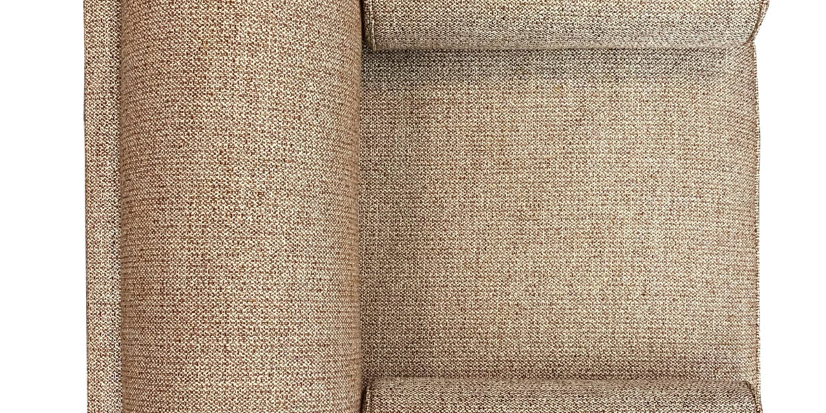 Vue de dessus d'une section de canapé modulaire texturé marron dans un showroom parisien, comportant un grand coussin de dossier et deux plus petits. Canape Paris by Atelier Bis