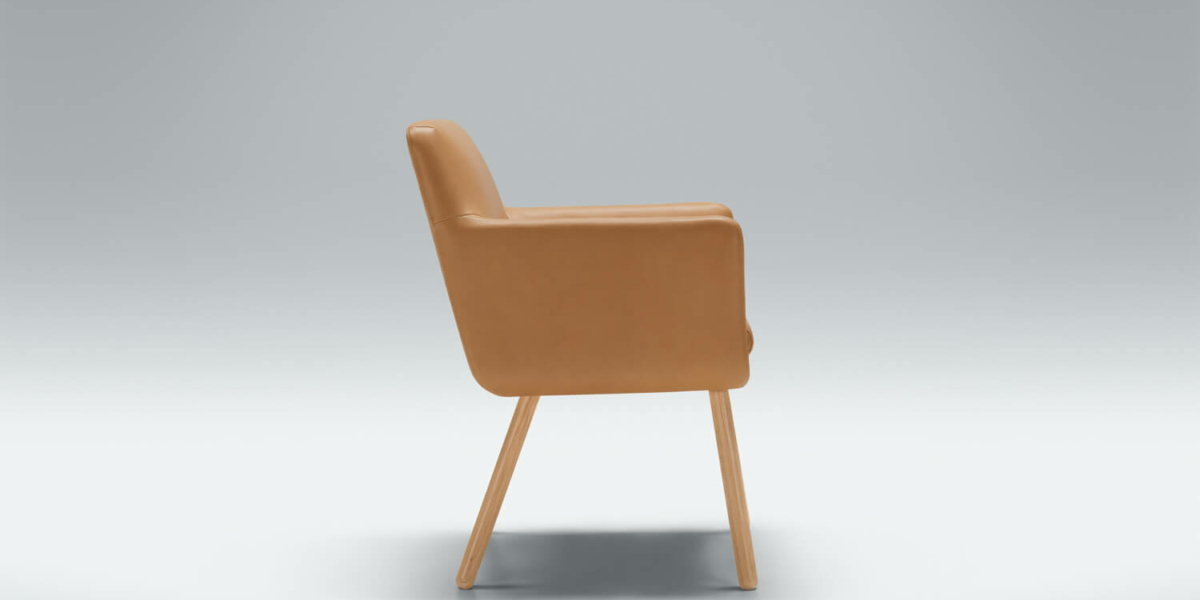 61cedddd721bda2ad7e2e75a_MOA_studio_bistro_chair_Aniline_latte_2 Fauteuil Moa Bistro en cuir cognac avec un tapis à motifs géométriques Le fauteuil en cuir cognac est posé sur un tapis à motifs géométriques, apportant du caractère à un salon contemporain.