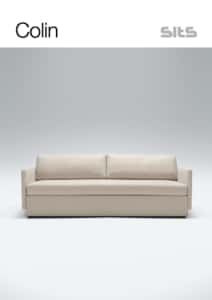 Canapé beige minimaliste sur fond gris avec les textes « Colin » et « assis » au-dessus, reflétant la qualité parisienne. Canape Paris by Atelier Bis